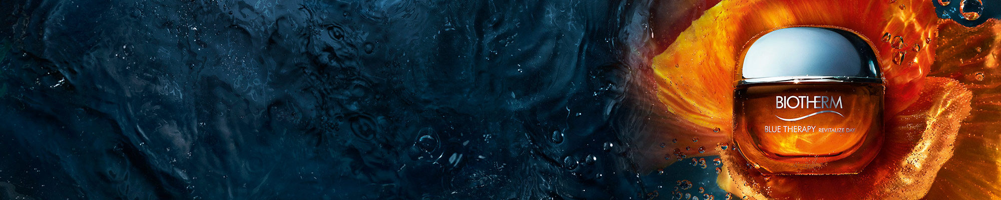 Biotherm skincare jar in orange with chrome lid, set against dark blue and fiery orange background representing potency.