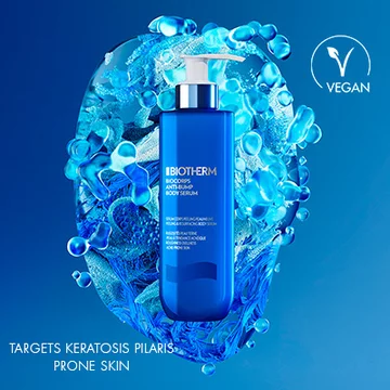 Biotherm Body Refirm Stretch Oil in vibrant blue bottle against fluid blue heart-shaped background, labeled as vegan and suitable for keratosis-prone skin.