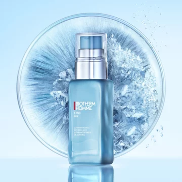 Zoomed view of Biotherm Homme skincare bottle positioned in front of a frosty radial burst effect.